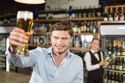 Man toasting a beer