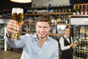 Man toasting a beer