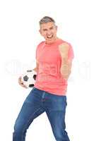 Happy guy holding a soccer ball