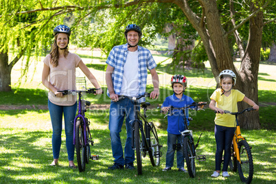 Smiling family with their bikes
