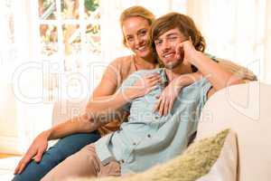 Cute couple hugging and resting on the couch