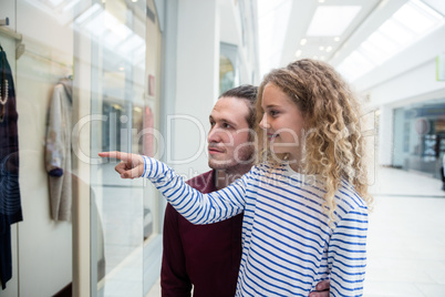 Happy father and daughter in shopping mall