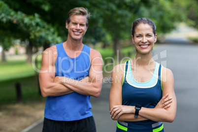 Fit people posing with crossed arms