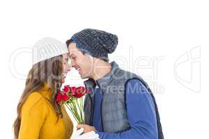 Happy couple holding a flower bouquet