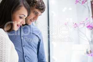 Happy couple shopping in mall