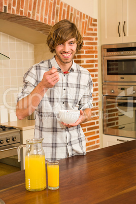 Handsome man having breakfast