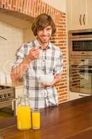 Handsome man having breakfast