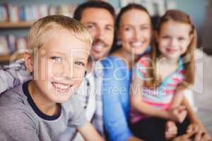 Happy boy with family on sofa