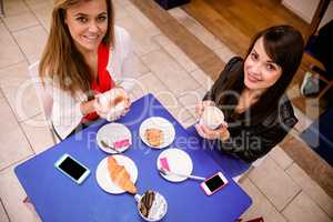 Women having coffee and snacks