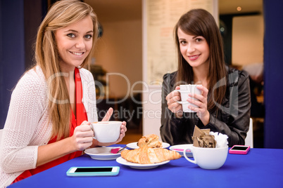 Portrait of women having coffee and snacks at a coffee shop