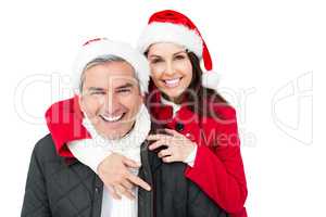 Festive couple with santa hat embracing