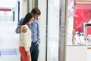 Couple looking at window display