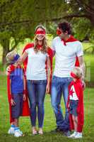 Happy family pretending to be superhero