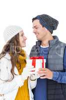 Happy couple holding gift box together