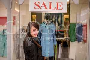 Portrait of beautiful woman window shopping