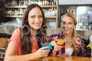 Women holding glasses of cocktail