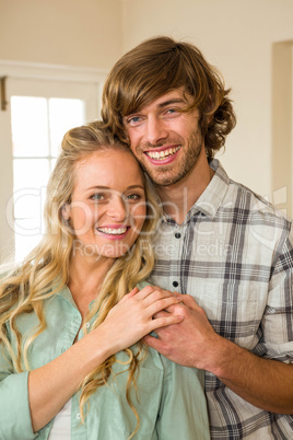 Cute couple hugging with arms around