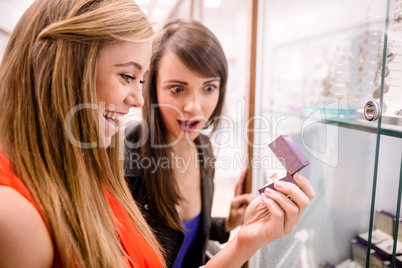 Two beautiful women selecting a finger ring