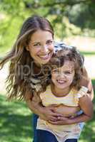 Mother and daughter standing