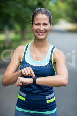 Sportswoman checking her heart rate watch