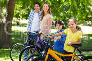 Smiling family with their bikes