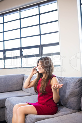 Beautiful business woman using mobile phone