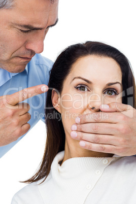 Man covering wifes mouth