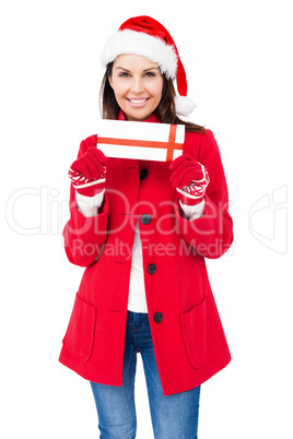 Beautiful brunette holding a christmas gift