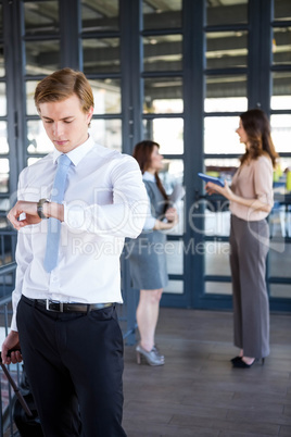 Successful businessman checking time