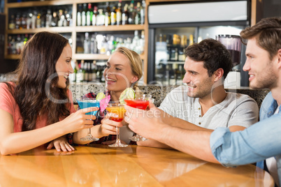 Friends toasting with cocktails