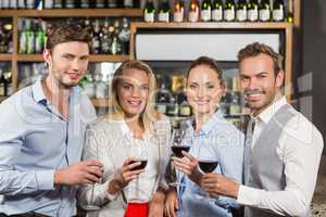 Friends toasting with red wine