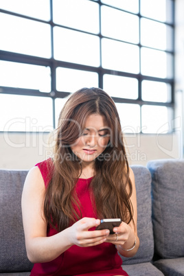 Beautiful business woman using mobile phone