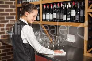 Barmaid cleaning table