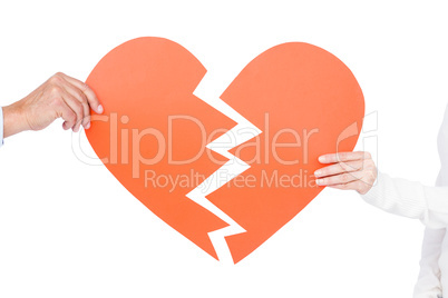 Couple holding broken heart
