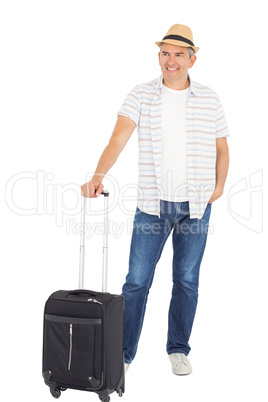 Handsome man posing with baggage
