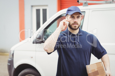 Delivery man making a phone call