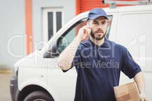 Delivery man making a phone call