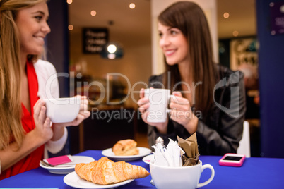 Women having coffee and snacks at a coffee shop