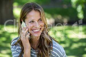 Smiling woman making a phone call