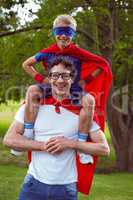 Father and son dressed as superman