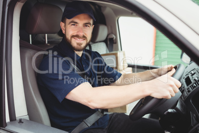 Delivery man driving his van