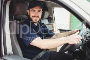 Delivery man driving his van