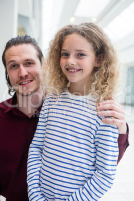 Happy father and daughter in shopping mall