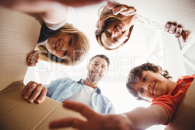 Smiling family with cardboard boxes