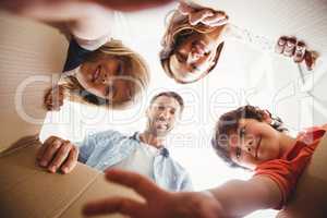 Smiling family with cardboard boxes