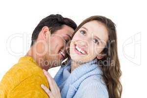 Smiling couple embracing and kissing