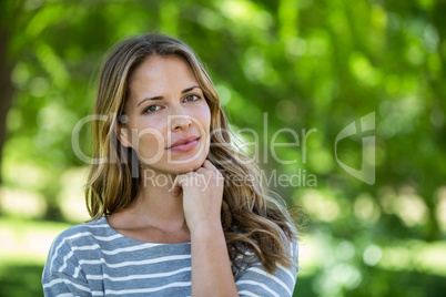 Portrait of a woman touching her chin