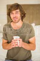 Handsome man drinking coffee