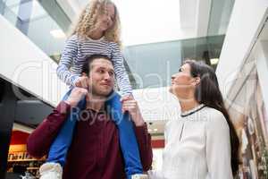 Happy family in shopping mall