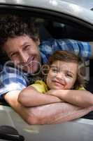 Father and daughter sitting in a car